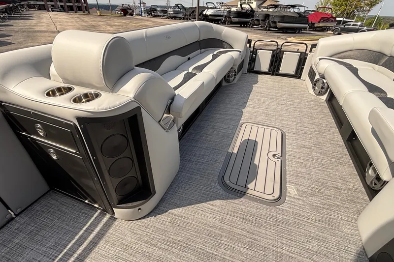 Slide: The Image of Luxurious interior of 2026 JC NEPTOON 27TT SPORT pontoon boat with plush seating and speakers. - 23