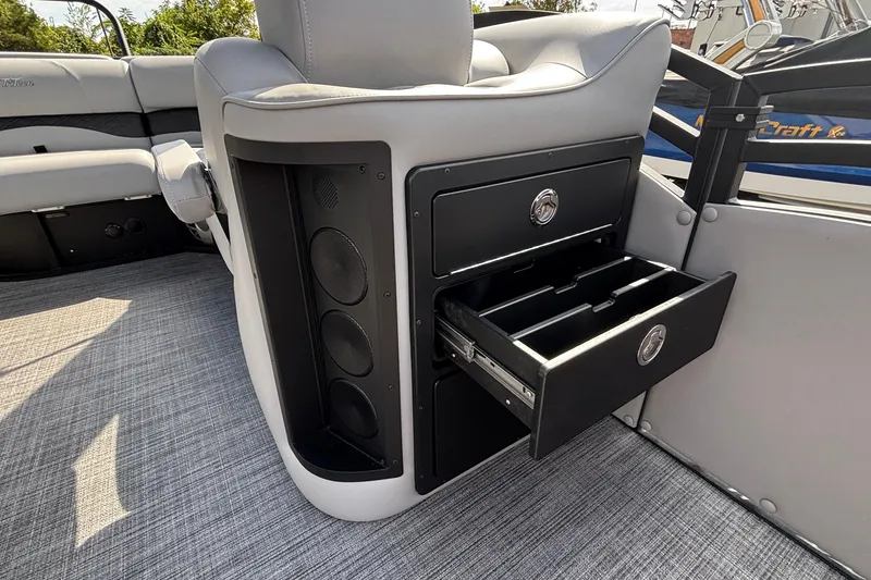 Slide: The Image of Interior of 2026 JC NEPTOON 27TT SPORT boat with open storage drawer. - 37