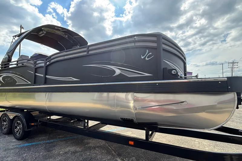 Slide: The Image of 2026 JC NEPTOON 27TT SPORT pontoon boat on trailer under cloudy sky. - 47