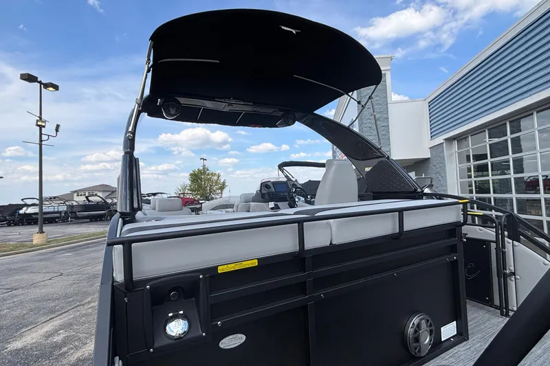 Slide: The Image of 2026 JC NEPTOON 27TT SPORT boat with canopy, parked outdoors under a blue sky. - 6