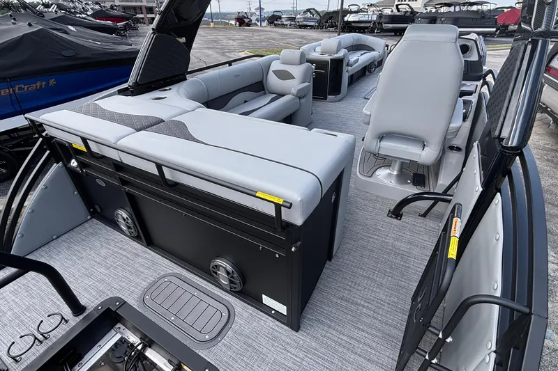 Slide: The Image of 2026 JC NEPTOON 27TT SPORT boat interior with gray seating and modern design. - 11