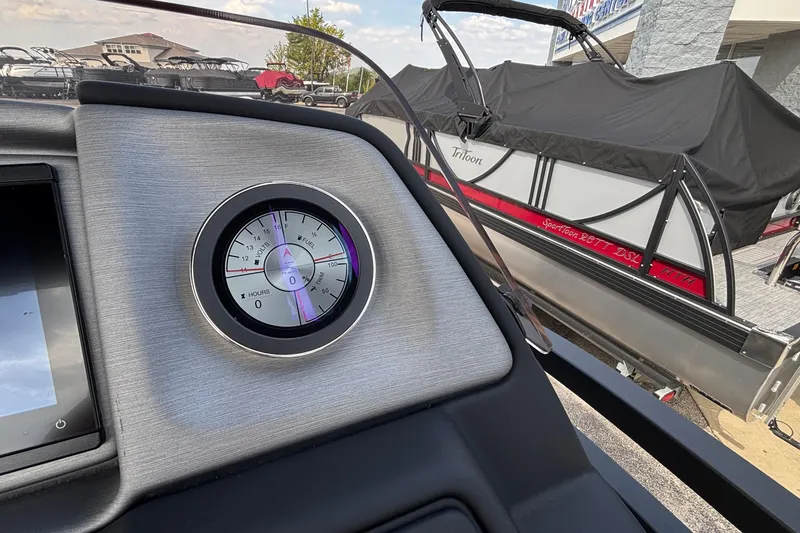 Slide: The Image of Close-up of a 2026 JC NEPTOON 27TT SPORT boat dashboard and fuel gauge. - 14