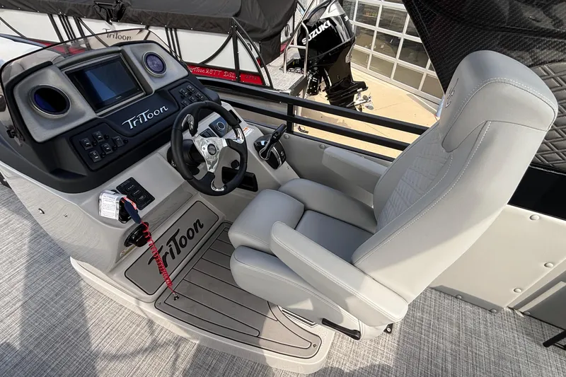 Slide: The Image of 2026 JC NEPTOON 27TT SPORT boat cockpit with steering wheel and control panel. - 15