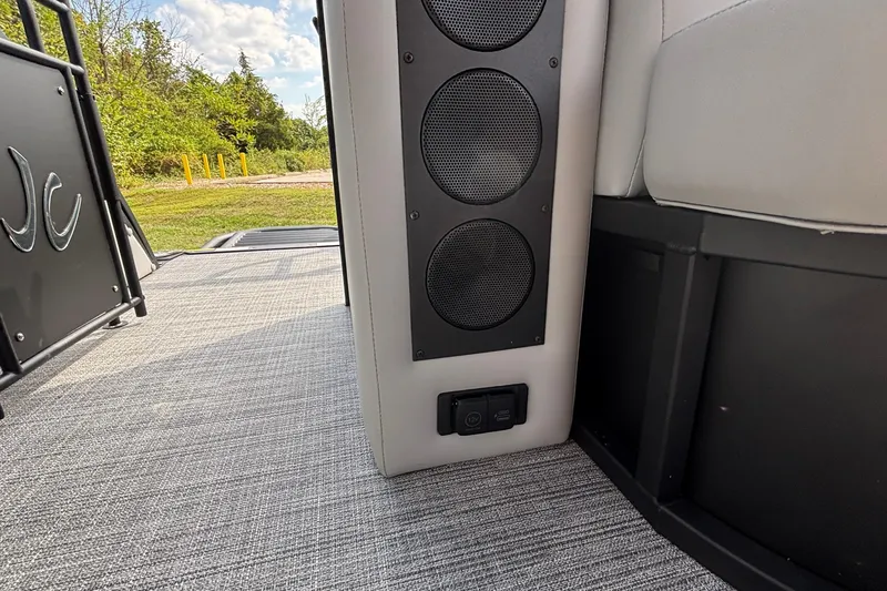 Slide: The Image of Interior of 2026 JC NEPTOON 27TT SPORT boat with speakers and seating. - 19