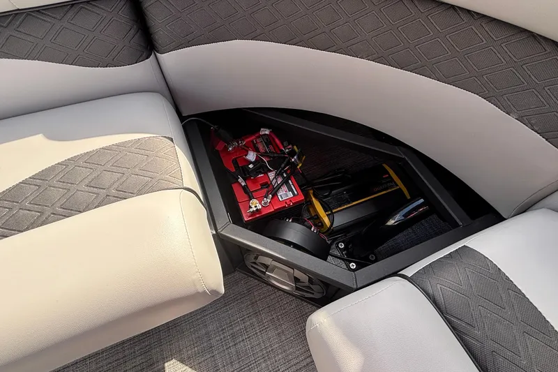 Slide: The Image of Interior of 2026 JC NEPTOON 27TT SPORT boat showing storage compartment with battery. - 22