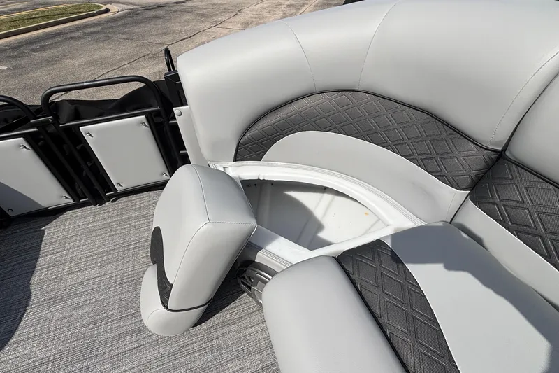 Slide: The Image of 2026 JC NEPTOON 27TT SPORT boat interior with gray cushioned seating and storage compartment. - 32