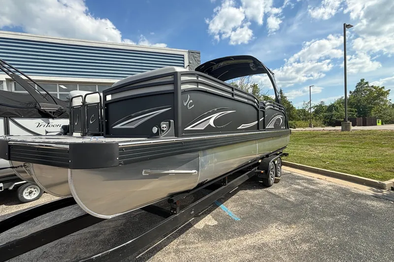 Slide: The Image of 2026 JC NEPTOON 27TT SPORT pontoon boat on trailer, parked outdoors under blue sky. - 48