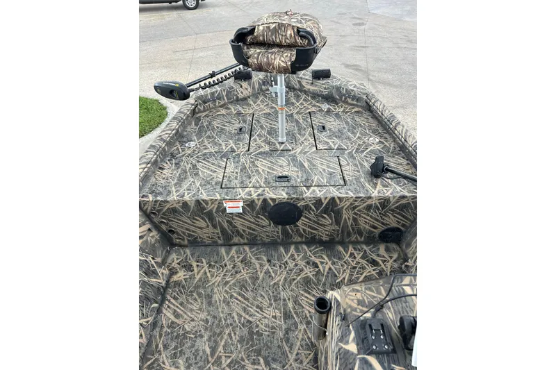 Slide: The Image of 2016 Lowe Roughneck 1756SC boat with camouflage design and fishing seat. - 11