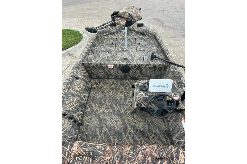 Slide: The Image of 2016 Lowe Roughneck 1756SC boat with camouflage design and Garmin navigation system. - 12