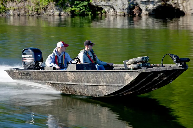 Slide: The Image of Manufacturer Provided Image: 2016 Lowe Roughneck 1756SC boat cruising on a lake with two passengers. - 14