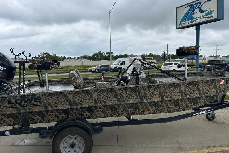 Slide: The Image of 2016 Lowe Roughneck 1756SC boat with camouflage design at Premier Boating Center. - 3