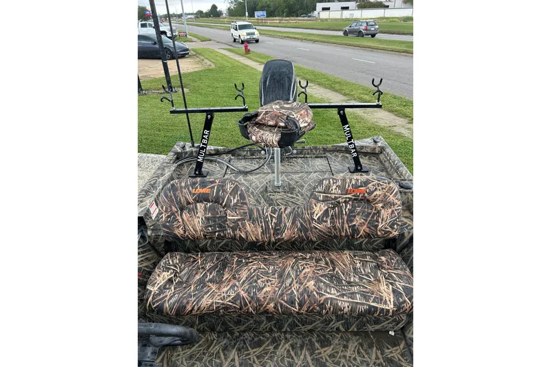 Slide: The Image of 2016 Lowe Roughneck 1756SC boat with camo seats and Multibar rod holders. - 7