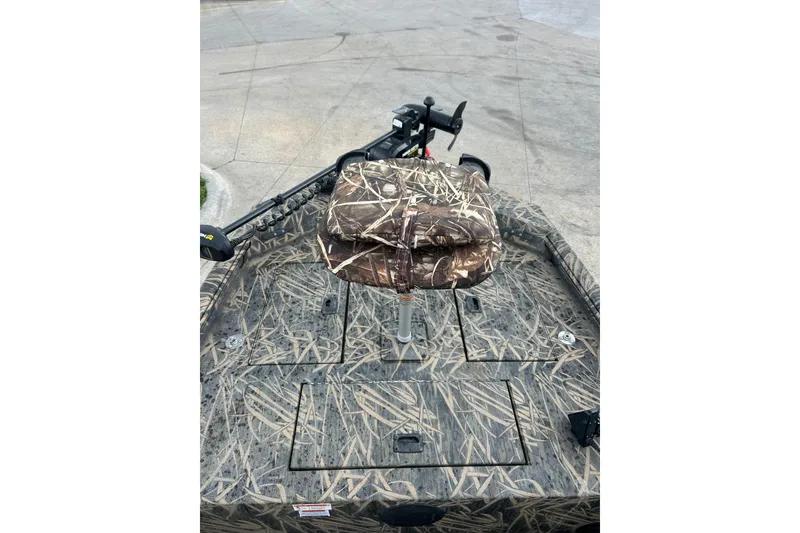 Slide: The Image of 2016 Lowe Roughneck 1756SC boat with camouflage seat and deck design. - 8