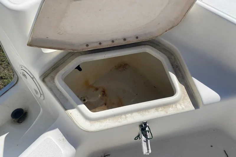 Slide: The Image of Open storage compartment on 2003 Hydra-Sports 180 CC boat. - 11