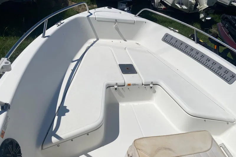 Slide: The Image of 2003 Hydra-Sports 180 CC boat interior with seating and measurement scale. - 2