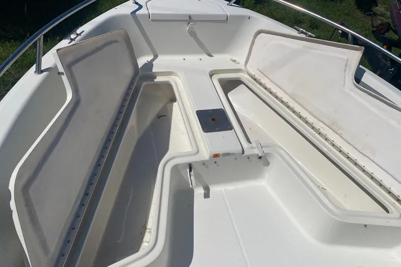 Slide: The Image of 2003 Hydra-Sports 180 CC boat interior with open storage compartments. - 3