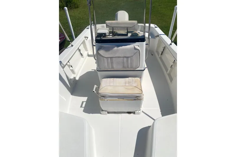 Slide: The Image of 2003 Hydra-Sports 180 CC boat interior with seating and console, white upholstery. - 4