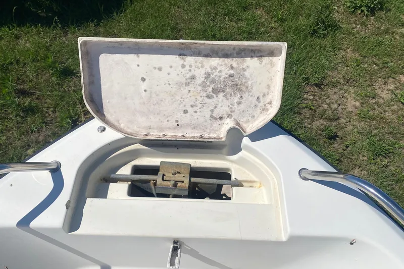 Slide: The Image of Open anchor compartment on 2003 Hydra-Sports 180 CC boat, showing storage area. - 5