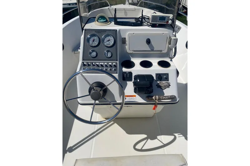 Slide: The Image of 2003 Hydra-Sports 180 CC boat console with steering wheel and gauges. - 6
