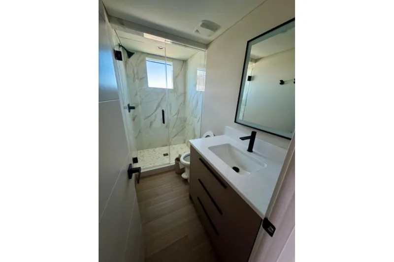 Slide: The Image of Modern bathroom in 2024 Adonia Aspire Trip #7 with glass shower and sleek vanity. - 10