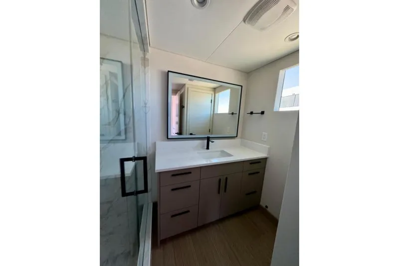 Slide: The Image of Modern bathroom in 2024 Adonia Aspire Trip #7 with sleek vanity and glass shower. - 15
