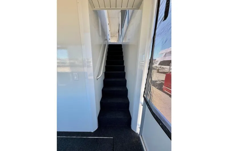 Slide: The Image of Interior staircase of 2024 Adonia Aspire Trip #7, featuring modern design and carpeted steps. - 17