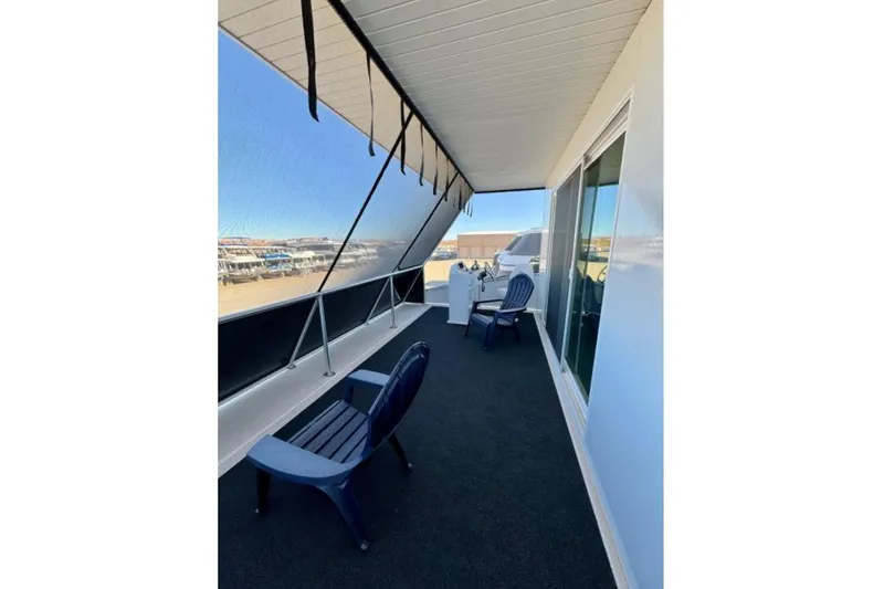 Slide: The Image of Covered deck area on 2024 Adonia Aspire Trip #7 with chairs and scenic view. - 20