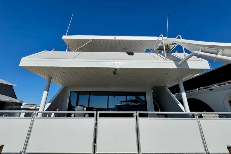 Slide: The Image of 2024 Adonia Aspire Trip #7 yacht, modern design, docked under clear blue sky. - 32