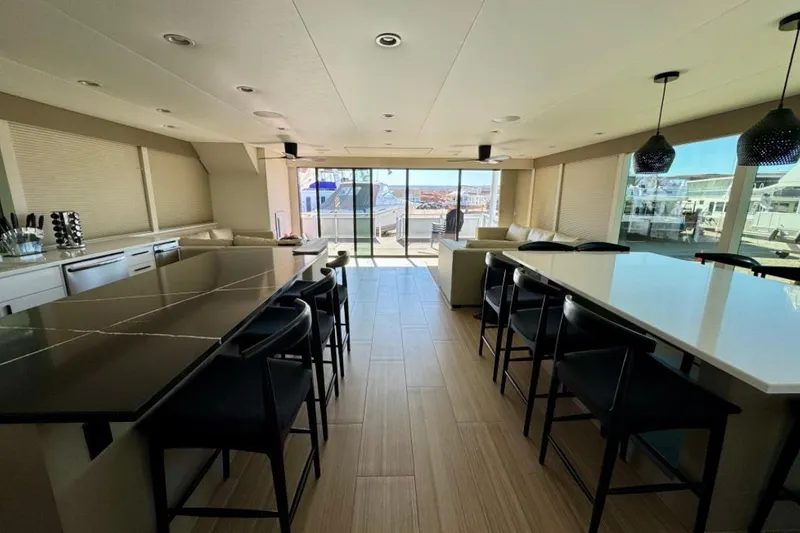 Slide: The Image of Luxurious interior of 2024 Adonia Aspire Trip #7 with modern kitchen and seating area. - 4