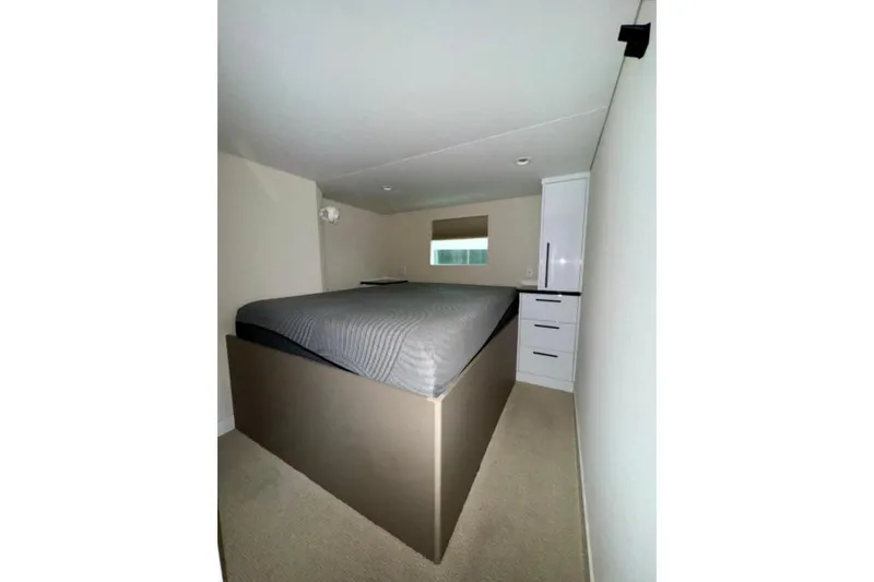 Slide: The Image of Compact bedroom in 2024 Adonia Aspire Trip #7 RV with bed and storage. - 7