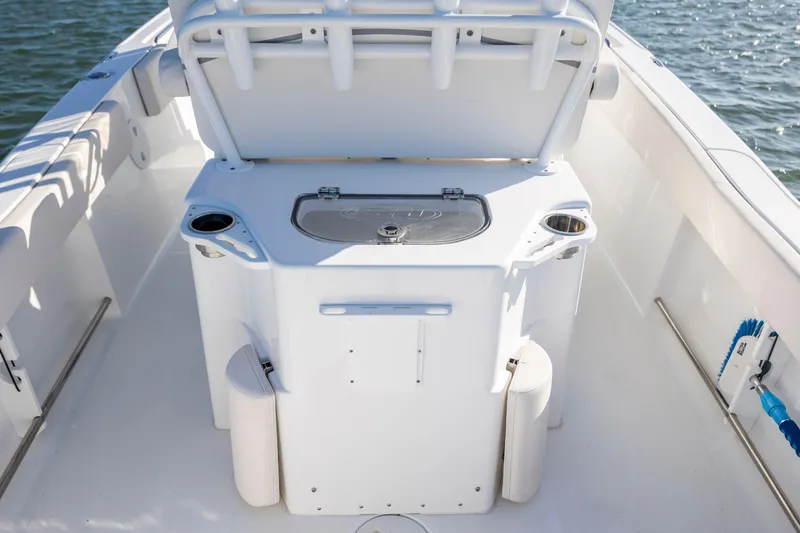 Slide: The Image of 2023 Sea Hunt Ultra 234 boat interior with seating and storage. - 24