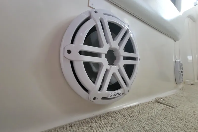Slide: The Image of White JL Audio speaker on 1998 Wellcraft 3200 Martinique boat interior. - 22