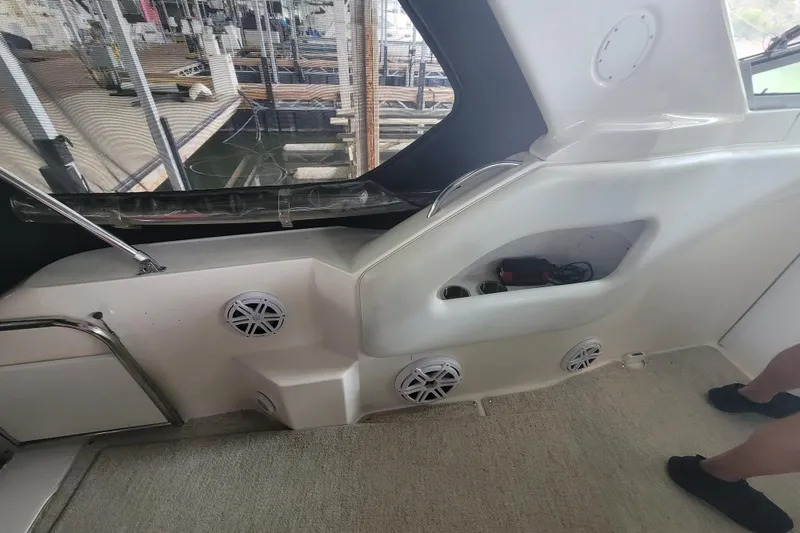 Slide: The Image of Interior of a 1998 Wellcraft 3200 Martinique boat with speakers and storage compartments. - 23