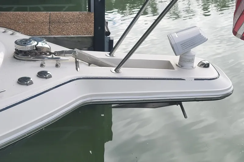 Slide: The Image of Bow of 1998 Wellcraft 3200 Martinique boat with anchor and spotlight. - 9