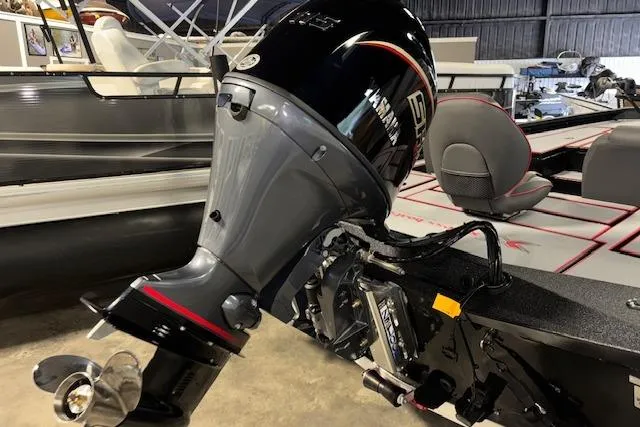 Slide: The Image of 2026 Xpress H18 Bass boat with Yamaha outboard motor in showroom. - 10