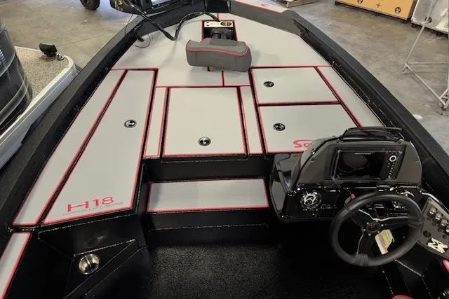 Slide: The Image of 2026 Xpress H18 Bass boat interior with modern dashboard and seating. - 19