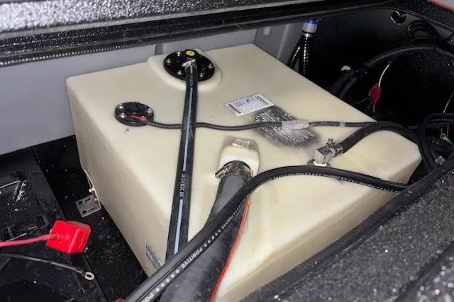 Slide: The Image of Fuel tank of 2026 Xpress H18 Bass boat with connected hoses and wiring. - 20