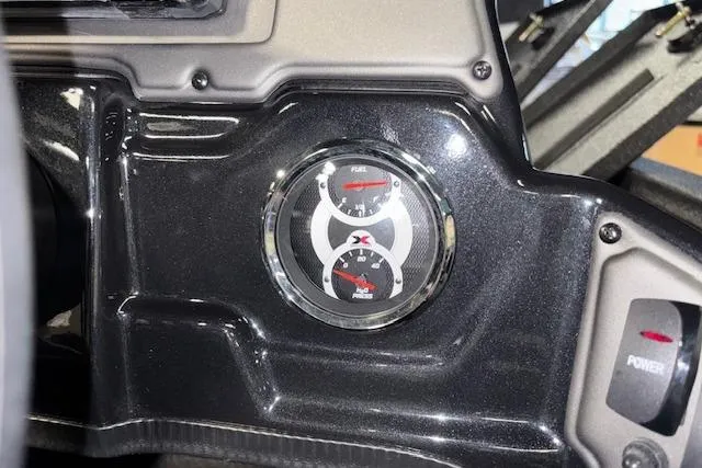 Slide: The Image of Dashboard of 2026 Xpress H18 Bass boat with fuel gauge and power button. - 23