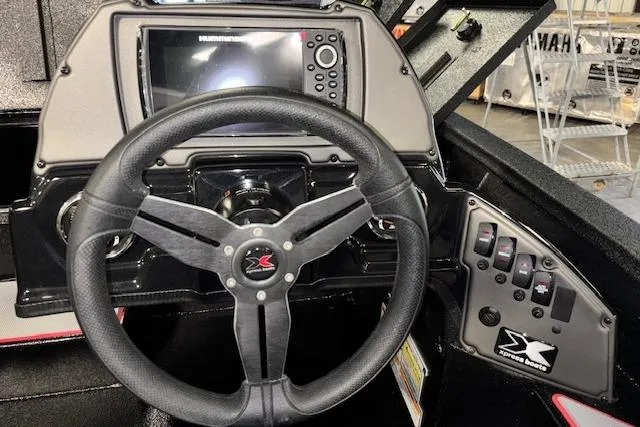 Slide: The Image of Steering console of 2026 Xpress H18 Bass boat with control panel and display. - 25