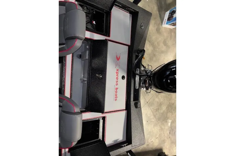 Slide: The Image of 2026 Xpress H18 Bass boat interior with seating and storage compartments. - 26