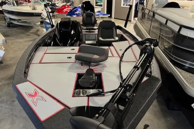 Slide: The Image of 2026 Xpress H18 Bass boat with sleek design and modern features in showroom. - 3