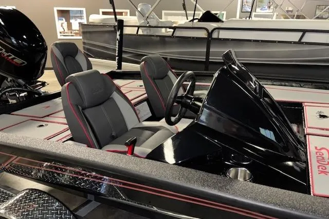 Slide: The Image of 2026 Xpress H18 Bass boat interior with sleek black console and comfortable seating. - 6