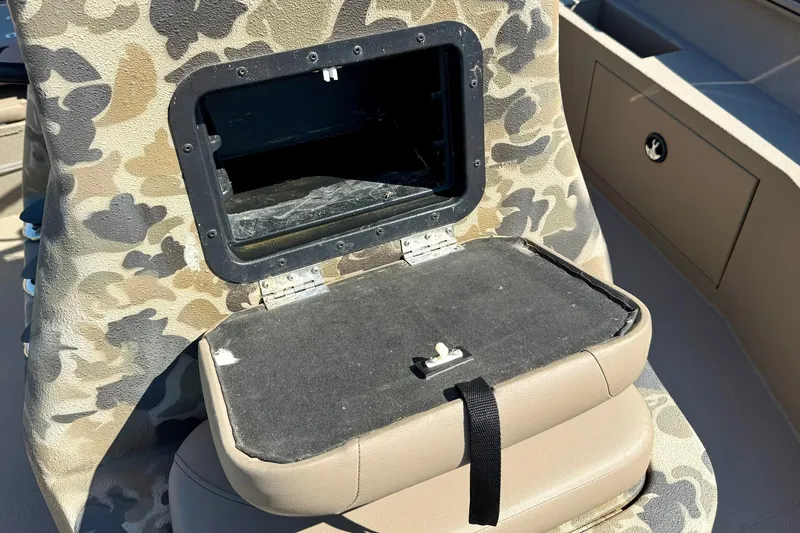 Slide: The Image of Camouflage-patterned storage compartment on 2019 Excel 230 Bay Pro boat. - 25