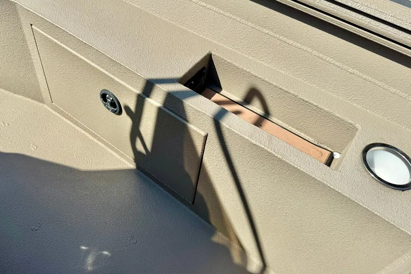 Slide: The Image of 2019 Excel 230 Bay Pro boat interior with storage compartment and shadow. - 35