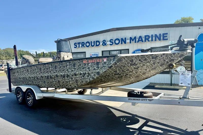Slide: The Image of 2019 Excel 230 Bay Pro boat on trailer at Stroud & Son Marine dealership. - 4