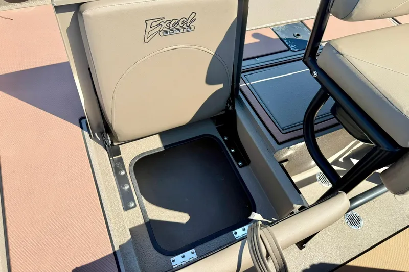 Slide: The Image of 2019 Excel 230 Bay Pro boat seat with storage compartment open. - 41