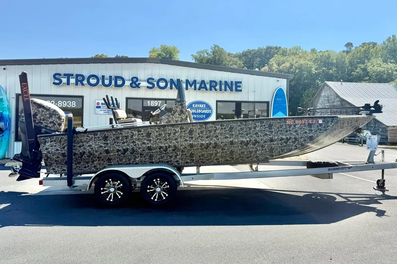Slide: The Image of 2019 Excel 230 Bay Pro boat on trailer at Stroud & Son Marine dealership. - 7