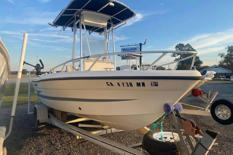 The Image of 1997 Hydra-Sports 1800 CC boat on trailer, parked outdoors under blue sky. - 0