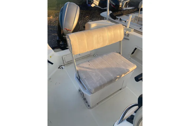 Slide: The Image of 1997 Hydra-Sports 1800 CC boat interior with cushioned seating and outboard motor. - 10