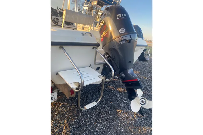 Slide: The Image of 1997 Hydra-Sports 1800 CC boat with Yamaha 90 outboard motor and swim ladder. - 14